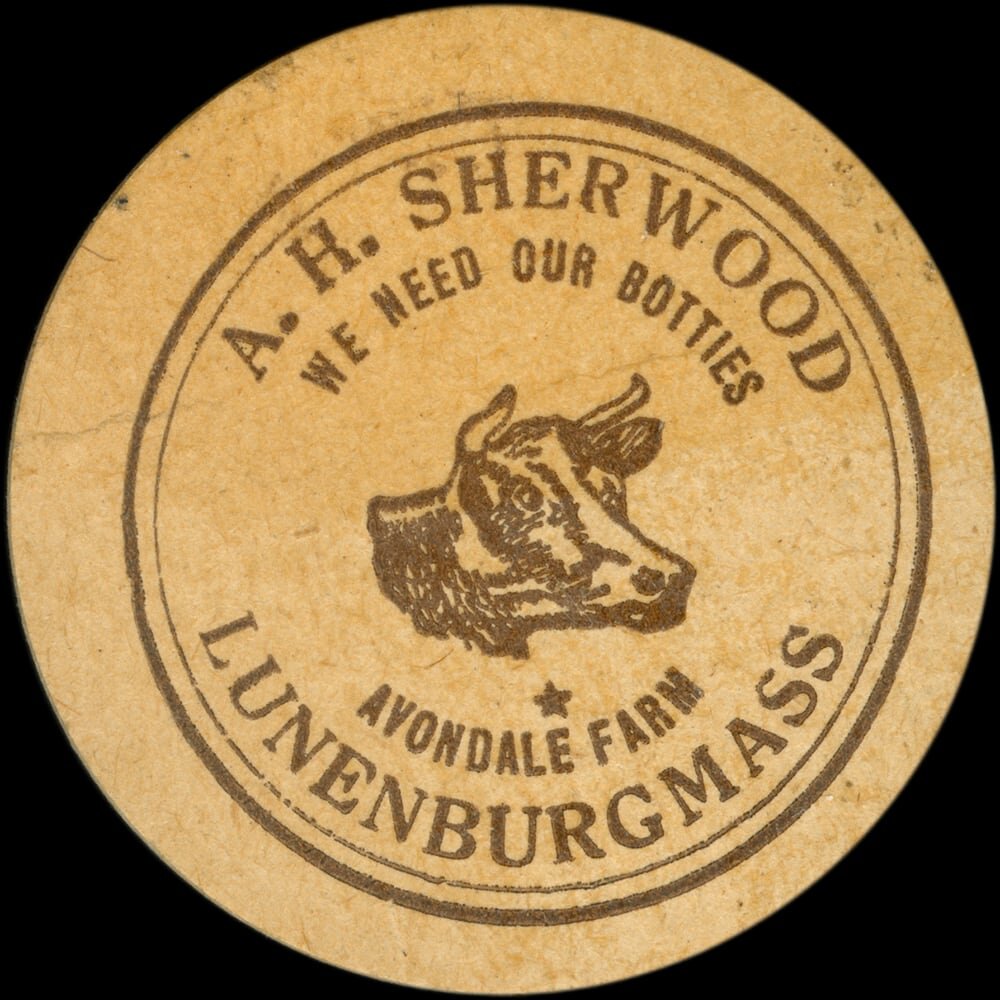 Vintage circular dairy cap with printed typographic milk advertising and a metal pull tab.