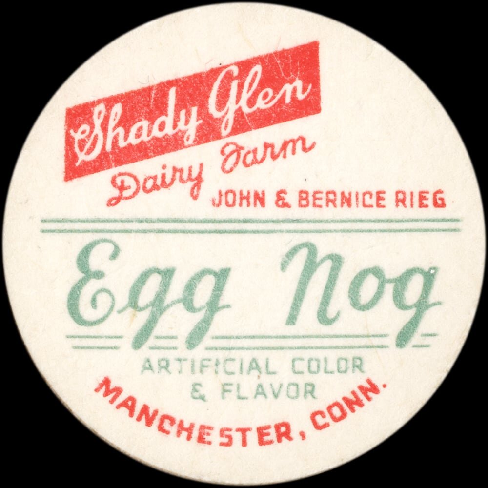 Vintage circular dairy cap with printed typographic milk advertising and a metal pull tab.