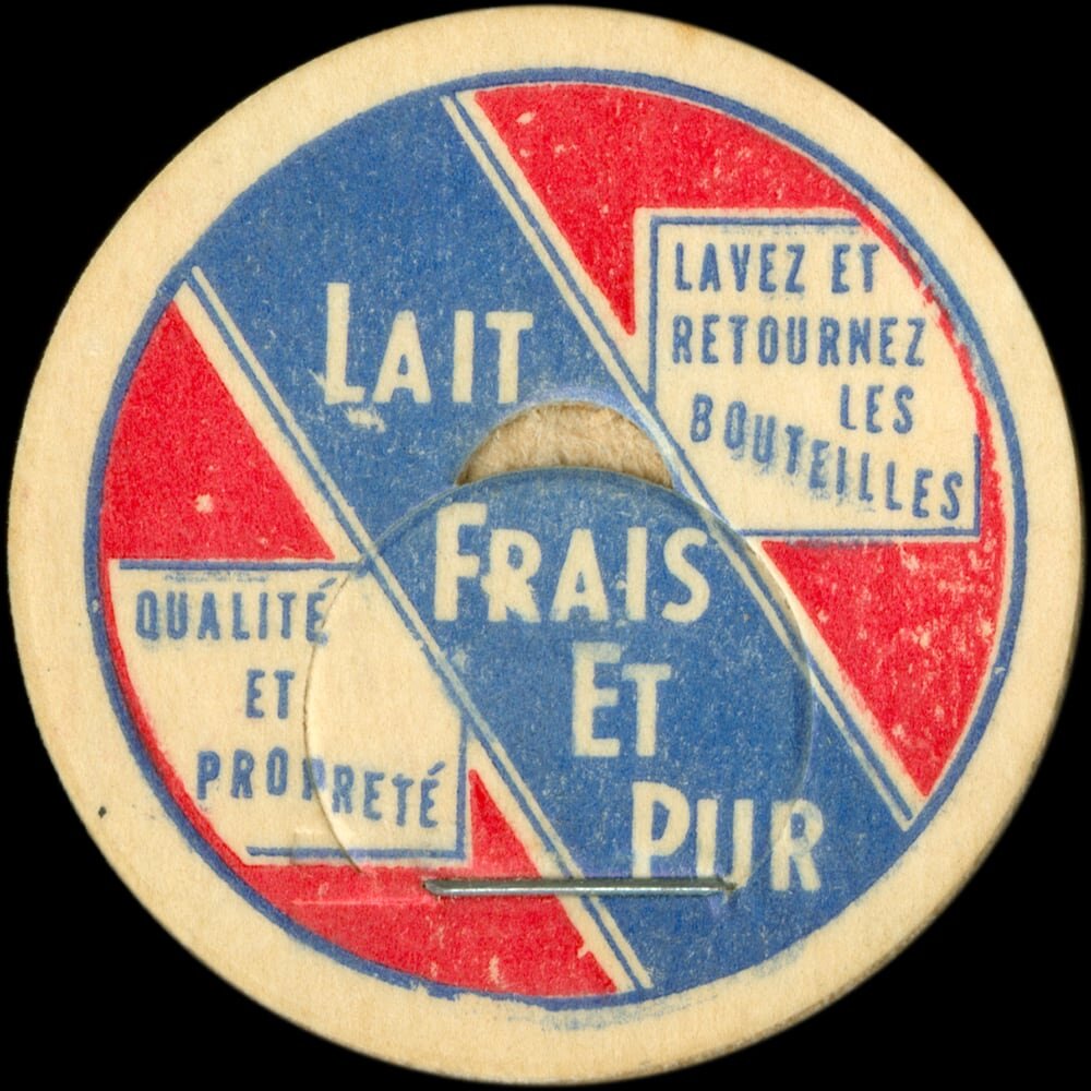 Vintage circular dairy cap with printed typographic milk advertising and a metal pull tab.