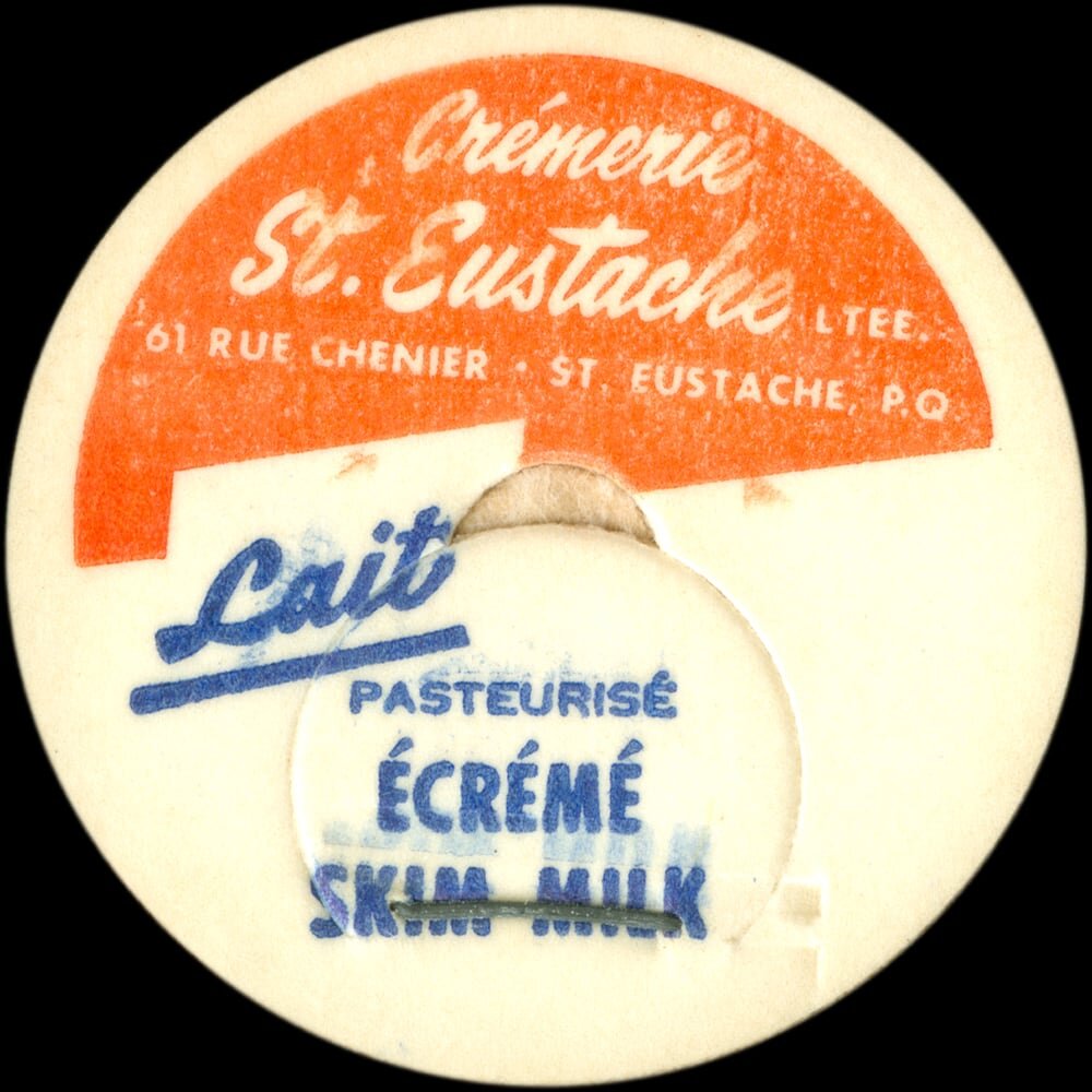 Vintage circular dairy cap with printed typographic milk advertising and a metal pull tab.