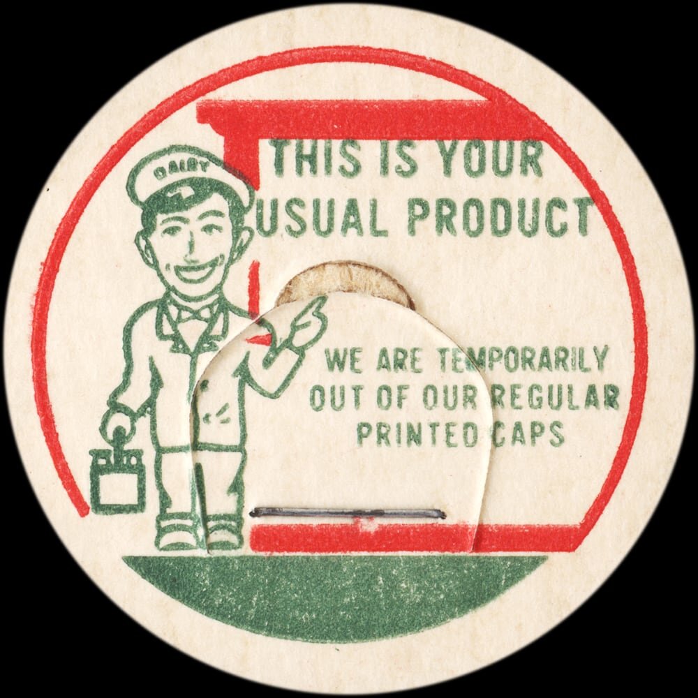 Vintage circular dairy cap with printed typographic milk advertising and a metal pull tab.