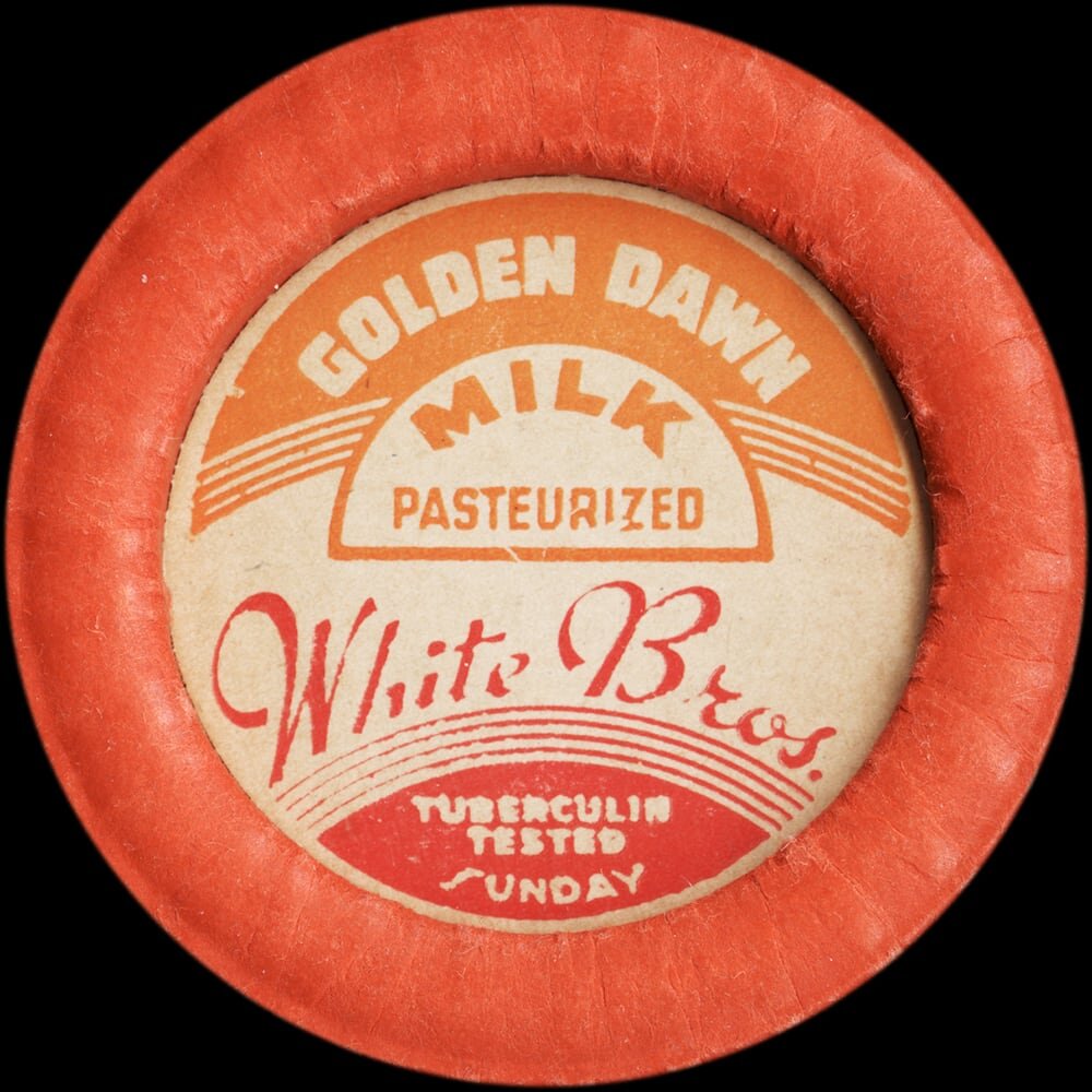 Vintage circular dairy cap with printed typographic milk advertising and a metal pull tab.